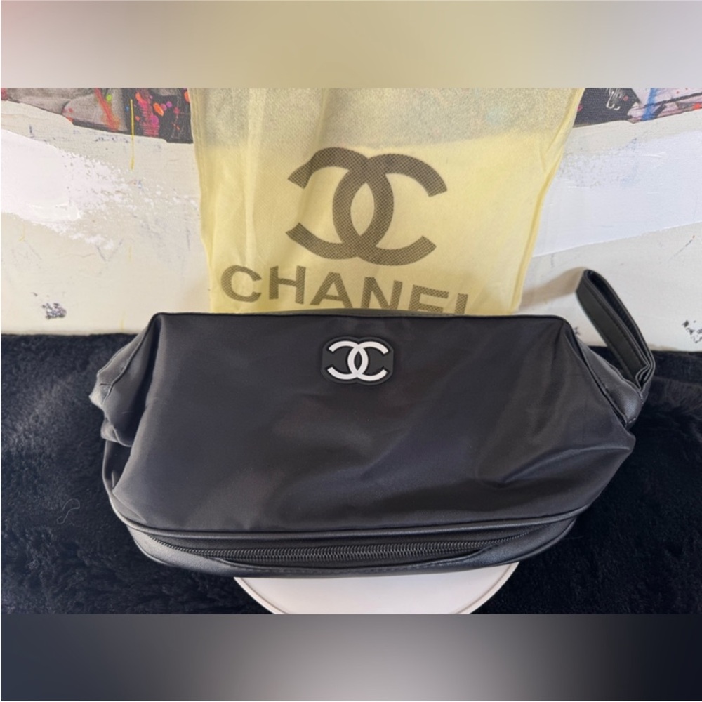 Chanel Black wristlet cosmetics bag with dustbag